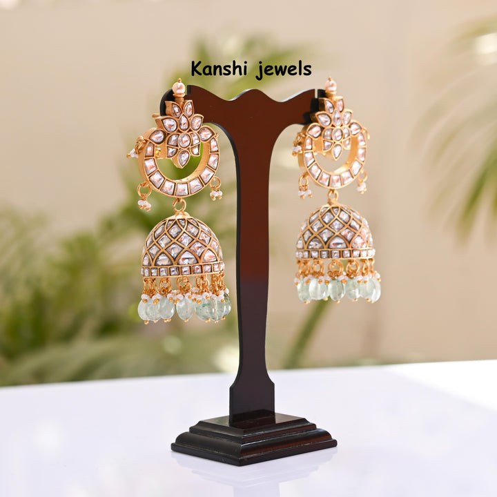 Jadau Kundan earrings by Kanshi Jewels,
Dulhan Kundan earrings,
Traditional Jadau earrings design,
Handcrafted Kundan earrings set,
Gold Jadau earrings for wedding,
Jadau Kundan earrings,
Kundan jhumka earrings,
