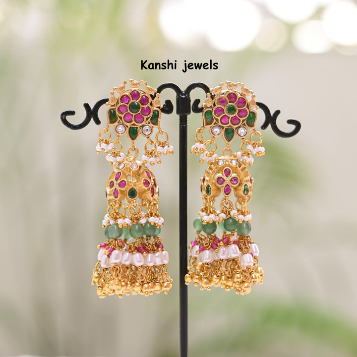 Jadau Kundan earrings by Kanshi Jewels,
Dulhan Kundan earrings,
Traditional Jadau earrings design,
Handcrafted Kundan earrings set,
Gold Jadau earrings for wedding,
Jadau Kundan earrings,
Kundan jhumka earrings,

