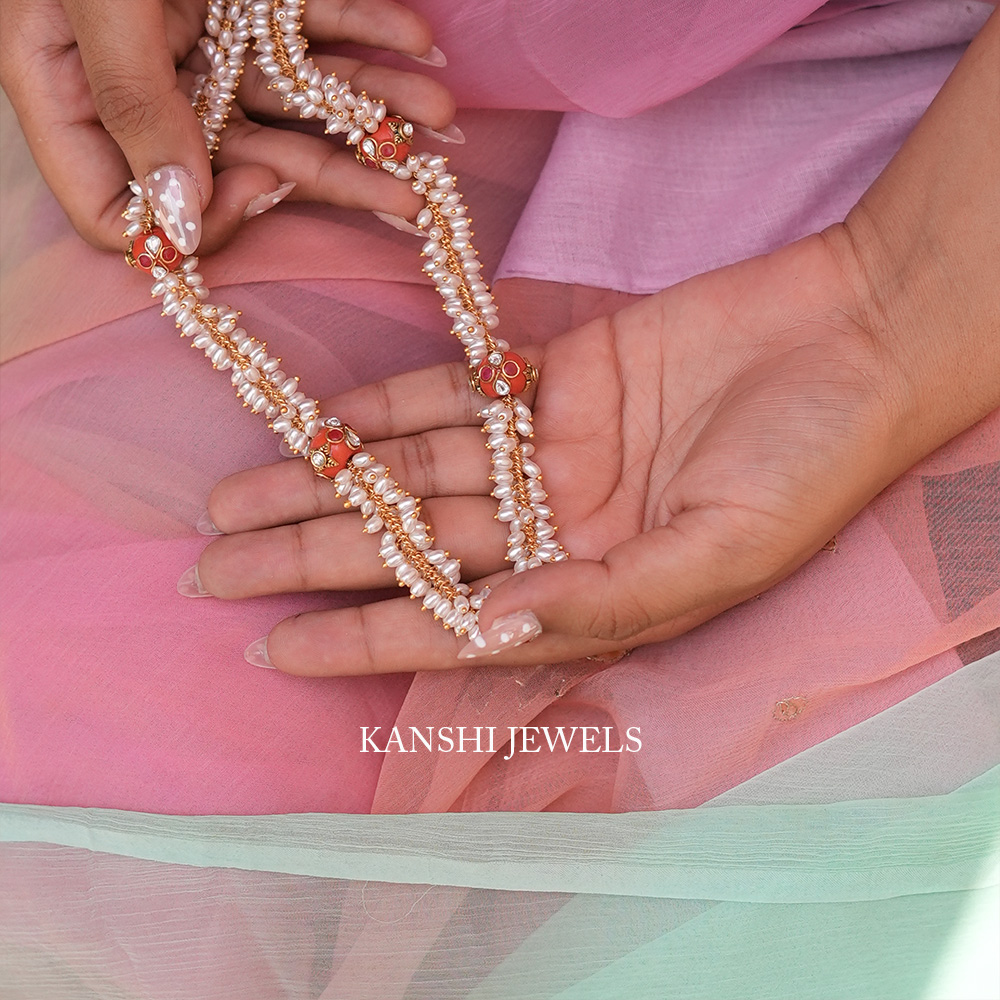 Elegant Rice Pearls Intricate Kundan Work Coral Accents